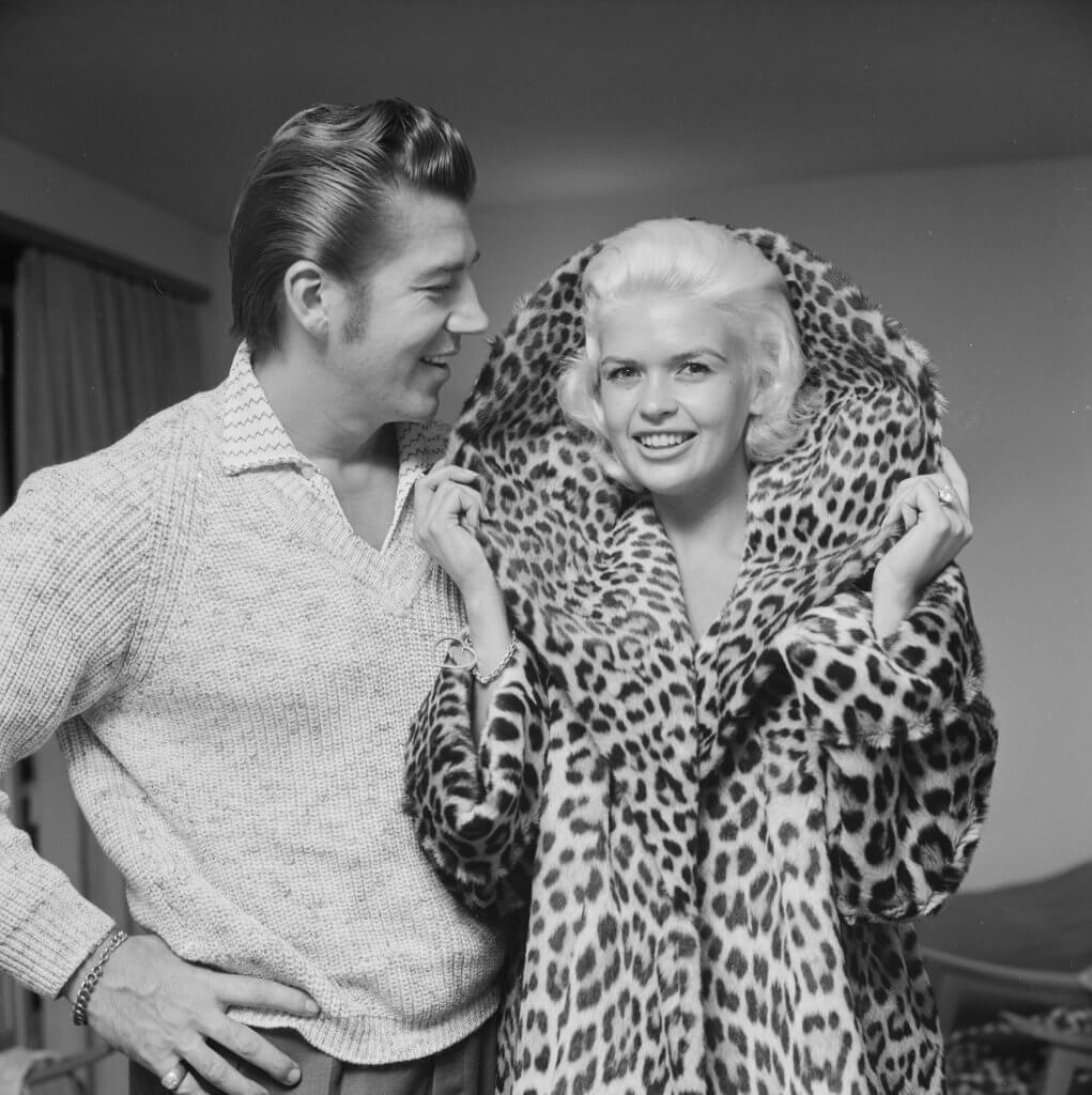 Jayne Mansfield wearing a leopard skin coat, with her husband Mickey Hargitay.