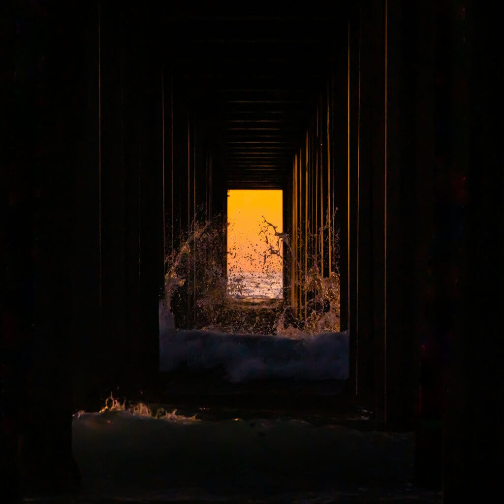 door opening in the dark reflecting that life is not normal it' all an illusion