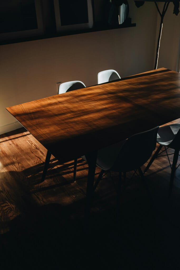 A dark table about a Robin Williams quote about death way of saying the table is ready