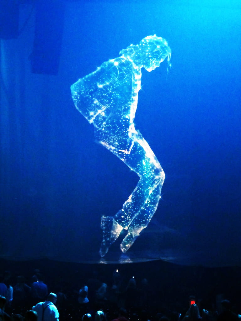 A glowing starlight projection of the late Michael Jackson, illustrating the concept of a digital afterlife.