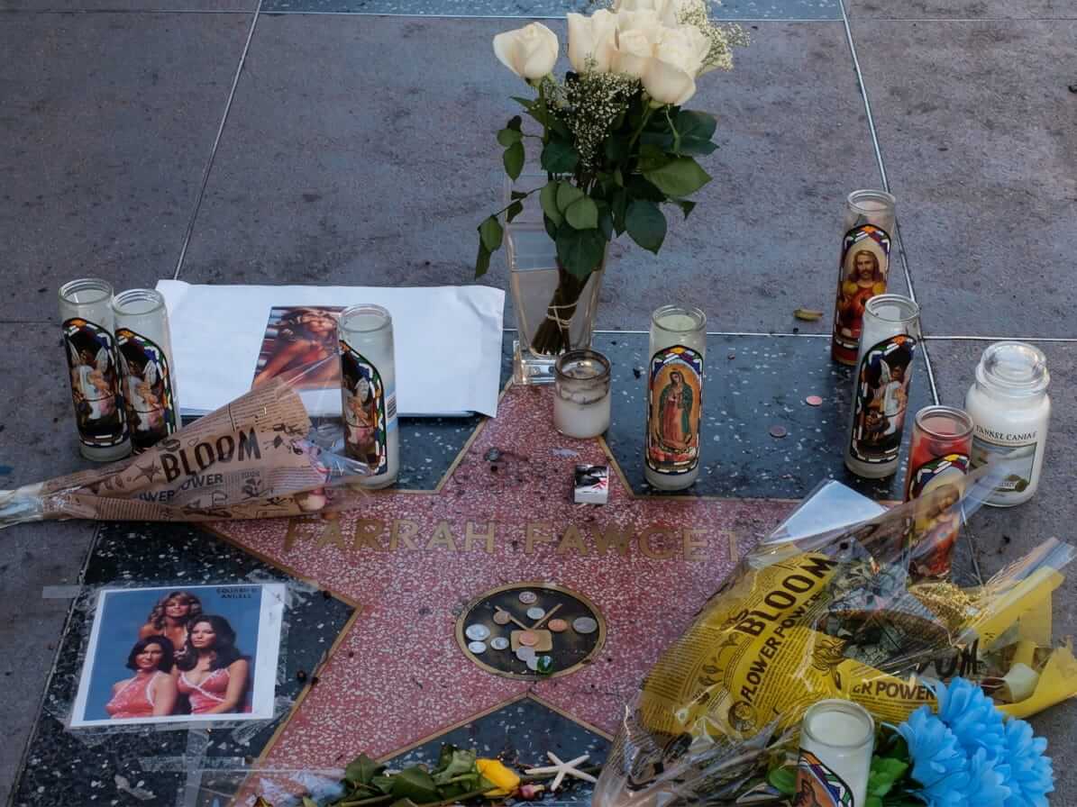 Flowers, candles and photos left as a memorial on Farrah Fawcett’s star on the Hollywood Walk of Fame